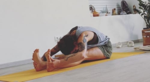 Seated Forward Bend (Paschimottanasana)&nbsp; (Instagram/@kaliyoga_studio)