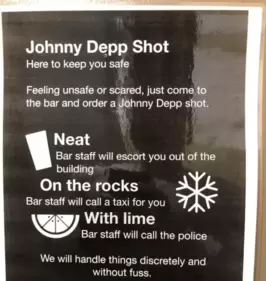 A bar sign with ‘Johnny Depp shots’. A bar sign with ‘Johnny Depp shots’.