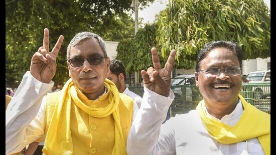 Suheldev Bharatiya Samaj Party (SBSP) president Om Prakash Rajbhar (L) flashes victory sign before casting his vote for the presidential election, at the Tilak Hall in UP Vidhan Bhavan, in Lucknow, Monday. (PTI Photo) Suheldev Bharatiya Samaj Party (SBSP) president Om Prakash Rajbhar (L) flashes victory sign before casting his vote for the presidential election, at the Tilak Hall in UP Vidhan Bhavan, in Lucknow, Monday. (PTI Photo)