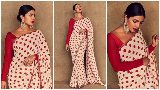 Priyanka Chopra draped herself in this polka dot saree to promote her film The Sky Is Pink. She displayed the beauty of the six yards of grace in this Sabyasachi creation bedecked with red polka print on a white backdrop, paired with a full-sleeved red silk blouse. Lastly, statement earrings and a centre-parted sleek bun completed her outfit.(Instagram/@priyankachopra)