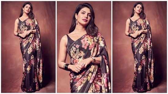 Everything about this black saree screams elegance. Priyanka chose this Sabyasachi number adorned with a multi-coloured floral pattern for a film's promotion. The Desi Girl teamed the six yards with a sleeveless blouse, black bangles, metallic strap watch, open tresses, her mangalsutra, diamond rings, and minimal makeup.(Instagram/@priyankachopra)
