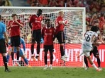 Trent Alexander-Arnold (R) kicks a free kick into the wall during the exhibition football match between Premier League teams Manchester United and Liverpool FC at Rajamangala National Stadium.(AFP) Trent Alexander-Arnold (R) kicks a free kick into the wall during the exhibition football match between Premier League teams Manchester United and Liverpool FC at Rajamangala National Stadium.(AFP)