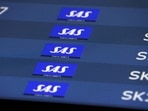 FILE PHOTO: SAS flights listed at Copenhagen airport, July 3, 2022. REUTERS/Andrew Kelly/File Photo