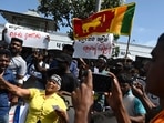 Demonstrators shout slogans against interim Sri Lanka's President Ranil Wickremesinghe during a protest in front of the Fort railway station in Colombo on July 19, 2022. (Photo by Arun SANKAR / AFP)