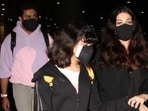 Aishwarya Rai Bachchan arrived in Mumbai with Abhishek Bachchan and their daughter, Aaradhya Bachchan. The paparazzi clicked the couple at the airport early in the morning, dressed in the comfiest outfits, as they returned from New York. The couple and their daughter spent family time together in the Big Apple. While Aishwarya and Aaradhya twinned in black, Abhishek accompanied them in a pastel-coloured tracksuit.(HT Photo/Varinder Chawla)