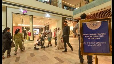 Notices regarding the ban on religious prayers put up inside the atrium of LuLu Mall, a day after controversy had broken out after a group of people allegedly offered namaz on the premises, in Lucknow. (PTI Photo) Notices regarding the ban on religious prayers put up inside the atrium of LuLu Mall, a day after controversy had broken out after a group of people allegedly offered namaz on the premises, in Lucknow. (PTI Photo)