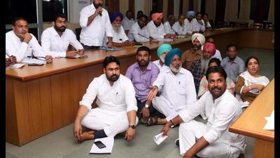 Councillors staging a protest during the Bathinda MC meeting on Tuesday. (Sanjeev Kumar/HT)
