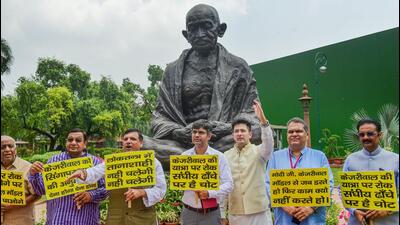 AAP MPs staging a protest at the Parliament in New Delhi on Tuesday. (PTI)