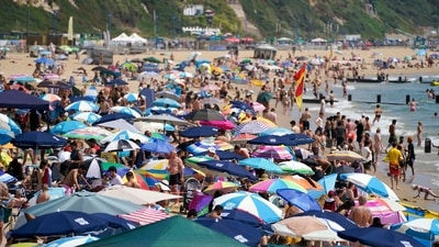 People throng the beach in Bournemouth, England on Tuesday. Britain shattered its record for highest temperature ever registered on Tuesday, with a provisional reading of 39.1 degrees Celsius (102.4 degrees Fahrenheit), according to the country's weather office — and the heat was only expected to rise. (AP) People throng the beach in Bournemouth, England on Tuesday. Britain shattered its record for highest temperature ever registered on Tuesday, with a provisional reading of 39.1 degrees Celsius (102.4 degrees Fahrenheit), according to the country's weather office — and the heat was only expected to rise. (AP)