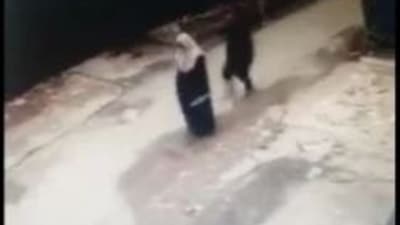 The CCTV grab of the burqa-clad woman before she was groped. (Twitter/Zobia Raja)