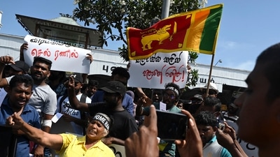 Demonstrators shout slogans against interim Sri Lanka's President Ranil Wickremesinghe during a protest in front of the Fort railway station in Colombo on July 19, 2022. (Photo by Arun SANKAR / AFP) (AFP) Demonstrators shout slogans against interim Sri Lanka's President Ranil Wickremesinghe during a protest in front of the Fort railway station in Colombo on July 19, 2022. (Photo by Arun SANKAR / AFP) (AFP)