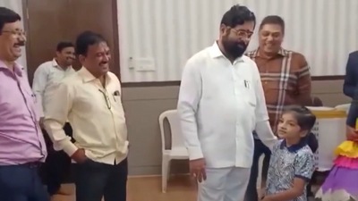 Maharashtra CM Eknath Shinde interacts with a girl at his Mumbai bungalow, Nandanvan.