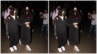 Aaradhya complemented her mother in a black hooded sweatshirt, teamed with a white round neck top and matching black joggers. Open tresses and white lace-up sneakers completed the little munchkin's airport fit. (HT Photo/Varinder Chawla) Aaradhya complemented her mother in a black hooded sweatshirt, teamed with a white round neck top and matching black joggers. Open tresses and white lace-up sneakers completed the little munchkin's airport fit. (HT Photo/Varinder Chawla)