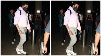 Meanwhile, Abhishek added some colour to his wife and daughter's all-black looks. He wore a lavender, pink and grey-coloured tracksuit set, making a case for wearing athleisure fits for catching flights. (HT Photo/Varinder Chawla) Meanwhile, Abhishek added some colour to his wife and daughter's all-black looks. He wore a lavender, pink and grey-coloured tracksuit set, making a case for wearing athleisure fits for catching flights. (HT Photo/Varinder Chawla)