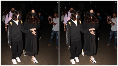 On Tuesday morning, Abhishek, Aishwarya and Aaradhya were clicked at the Mumbai airport. The 48-year-old actor wore an all-black ensemble for her jet-set look. It features a long midi-length dress with a breezy silhouette. A long coat in the same shade layered on top of the midi completed Aishwarya's outfit. (HT Photo/Varinder Chawla) On Tuesday morning, Abhishek, Aishwarya and Aaradhya were clicked at the Mumbai airport. The 48-year-old actor wore an all-black ensemble for her jet-set look. It features a long midi-length dress with a breezy silhouette. A long coat in the same shade layered on top of the midi completed Aishwarya's outfit. (HT Photo/Varinder Chawla)