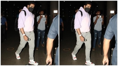 Abhishek wore a sweatshirt in lavender and pink shade, featuring long sleeves, hooded detail, and a fitted silhouette. A pair of grey joggers, white sneakers, and a quirky watch rounded off his airport outfit. (HT Photo/Varinder Chawla) Abhishek wore a sweatshirt in lavender and pink shade, featuring long sleeves, hooded detail, and a fitted silhouette. A pair of grey joggers, white sneakers, and a quirky watch rounded off his airport outfit. (HT Photo/Varinder Chawla)