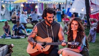 Arjun Kapoor and Tara Sutaria are the newest on-screen pair. On Tuesday, Tara Sutaria took to her Instagram handle and opened up about working with Arjun through several behind-the-scene pictures. She wrote, “This is us! You will often find us hungry, pinching each other’s cheeks, hungry again, telling terrible jokes (and laughing hysterically) making up ghastly nick names for each other… and then arguing because we need more food/a nap.” Arjun Kapoor and Tara Sutaria are the newest on-screen pair. On Tuesday, Tara Sutaria took to her Instagram handle and opened up about working with Arjun through several behind-the-scene pictures. She wrote, “This is us! You will often find us hungry, pinching each other’s cheeks, hungry again, telling terrible jokes (and laughing hysterically) making up ghastly nick names for each other… and then arguing because we need more food/a nap.”