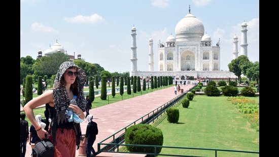 A foreign tourist visiting the Taj Mahal on a hot and humid day in Agra on Monday. (Agency/ For representation)