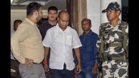 Pankaj Mishra being arrested by ED officials in Ranchi on Tuesday. (PTI)