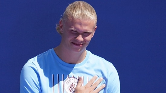 Erling Haaland greets fans during Manchester City's new signings presentation,(AP)