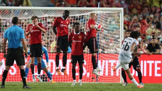 Trent Alexander-Arnold (R) kicks a free kick into the wall during the exhibition football match between Premier League teams Manchester United and Liverpool FC at Rajamangala National Stadium.(AFP)