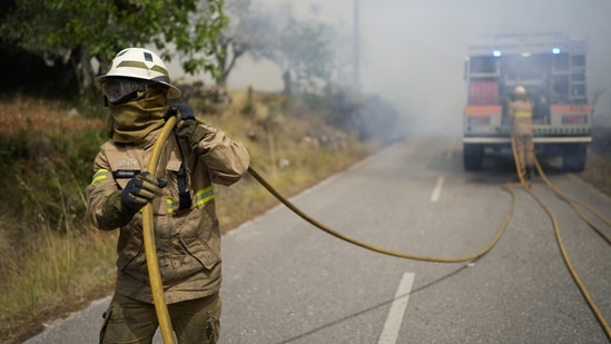 Charred bodies of an elderly couple, who were trying to escape the wildfires, were found inside a burned-out vehicle in the devastated Portuguese northern municipality of Murça, authorities said on Monday. “It is a completely dramatic situation that is happening in the municipality of Murça... more than half of the municipality on fire,” Murça's mayor, Mário Artur Lopes, told broadcasters. (AP)