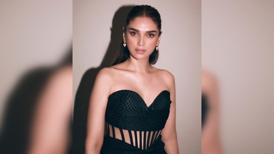 This body-hugging long-line silhouette features an intricate strapless bodice leading into a cinched corset waist.(Instagram/@stylebyami)