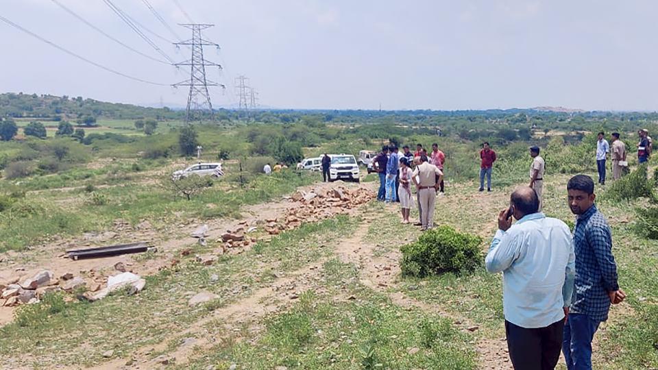 Police personnel at the crime scene after DSP Surender Singh Bishnoi was allegedly mowed down to death by the mining mafia at Pachgaon in Nuh district. (PTI photo)