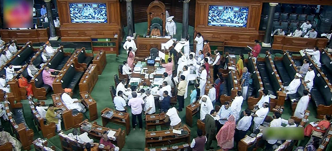 Opposition MPs holding placards stage a protest over inflation, 5% GST on essential items and other issues in the Well of Lok Sabha during the Monsoon Session of Parliament. (ANI) Opposition MPs holding placards stage a protest over inflation, 5% GST on essential items and other issues in the Well of Lok Sabha during the Monsoon Session of Parliament. (ANI)