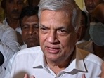 Sri Lanka's newly elected president Ranil Wickremesinghe addresses the media representatives during his visit at the Gangaramaya Buddhist temple in Colombo on Wednesday. (AFP)