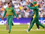 Tabraiz Shamsi (L) celebrates a wicket
