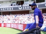 India's Jasprit Bumrah seats on the fence during the second ODI against England(Action Images via Reuters)