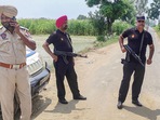 Amritsar: Punjab Police personnel during an encounter with gangsters suspected to be involved in the Sidhu Moose Wala murder case near Attari in Amritsar, Wednesday, July 20, 2022. (PTI Photo) Amritsar: Punjab Police personnel during an encounter with gangsters suspected to be involved in the Sidhu Moose Wala murder case near Attari in Amritsar, Wednesday, July 20, 2022. (PTI Photo)