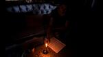 A girl studying with the help of candle light in Kharghar on Wednesday. The residents in some parts of Kharghar had to endure power outage for nearly 14 hours. BACHCHAN KUMAR/HT PHOTO (BACHCHAN KUMAR/HT PHOTO) A girl studying with the help of candle light in Kharghar on Wednesday. The residents in some parts of Kharghar had to endure power outage for nearly 14 hours. BACHCHAN KUMAR/HT PHOTO (BACHCHAN KUMAR/HT PHOTO)