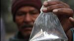 A villager shows a packet of hooch. (HT File Photo) A villager shows a packet of hooch. (HT File Photo)