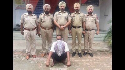 The man accused of murdering his wife in custody of Payal Police in Ludhiana on Wednesday. (HT Photo)