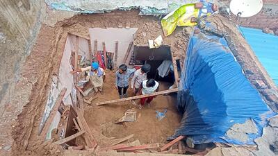 Villagers examining the house where a roof collapse killed 19-year-old Aneesh Kumar in Mubarakpur, Dera Bassi, on Wednesday. (Sant Arora/HT)