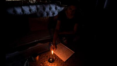 A girl studying with the help of candle light in Kharghar on Wednesday. The residents in some parts of Kharghar had to endure power outage for nearly 14 hours. BACHCHAN KUMAR/HT PHOTO (BACHCHAN KUMAR/HT PHOTO) A girl studying with the help of candle light in Kharghar on Wednesday. The residents in some parts of Kharghar had to endure power outage for nearly 14 hours. BACHCHAN KUMAR/HT PHOTO (BACHCHAN KUMAR/HT PHOTO)