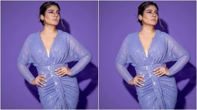 Styled by fashion stylist Surina Kakkar, Raveena wore her tresses into a messy bun with a few strands of hair left open, and a middle part. (Instagram/@officialraveenatandon)