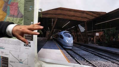 Rogelio Jiménez Pons, director of Fonatur, points to photos of a planned train through the Yucatan Peninsula, during an interview in Mexico City. The Mexican government invoked national-security powers to forge ahead with the tourist train along the Caribbean coast (AP Photo/Marco Ugarte, File) Rogelio Jiménez Pons, director of Fonatur, points to photos of a planned train through the Yucatan Peninsula, during an interview in Mexico City. The Mexican government invoked national-security powers to forge ahead with the tourist train along the Caribbean coast (AP Photo/Marco Ugarte, File)