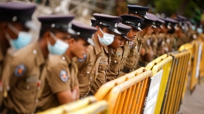Policemen stand guard at a barricade outside the Parliament building, as voting begins to elect the new President, amid the country's economic crisis. (Reuters)