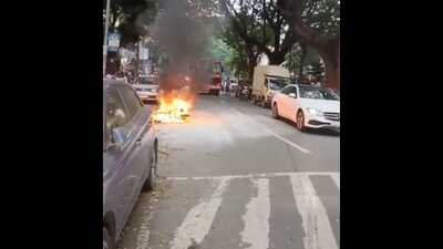 A two-wheeler in transit caught fire at Mukundnagar in Swargate on Tuesday. (HT PHOTO) A two-wheeler in transit caught fire at Mukundnagar in Swargate on Tuesday. (HT PHOTO)