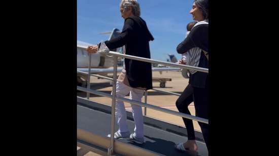 The image, taken from the viral video, shows the elderly woman boarding a plane. (Instagram/@journeywithdrish)