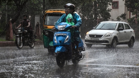 New Delhi: Vehicles ply on a road during monsoon rain in New Delhi, Wednesday.(PTI)