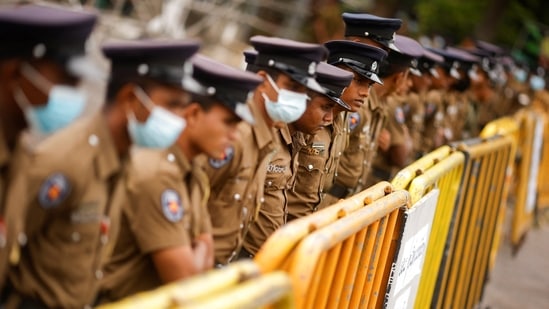 Policemen stand guard at a barricade outside the Parliament building, as voting begins to elect the new President, amid the country's economic crisis.(Reuters)