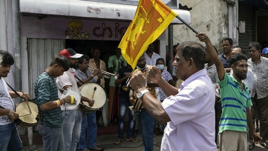 People play drums to celebrate after Wickremesinghe was chosen as the President. (Bloomberg)