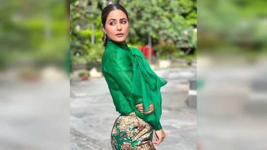 Hina Khan amped up her look by teaming her outfit with transparent wedges and hoop earrings.(Instagram/@realhinakhan)