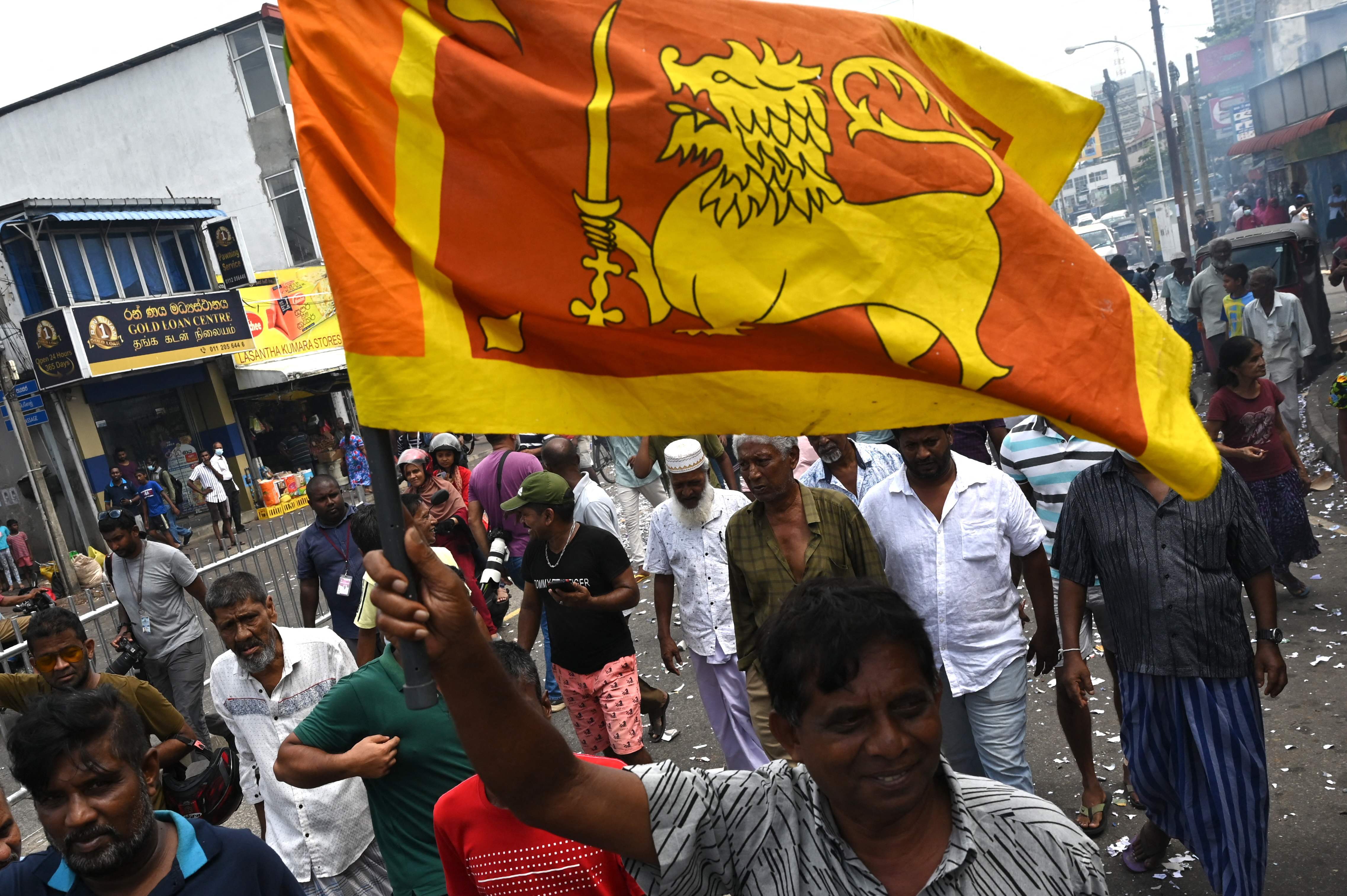 Supporters of newly elected Sri Lankan President Ranil Wikeramasinghe celebrate in Colombo. (AFP) Supporters of newly elected Sri Lankan President Ranil Wikeramasinghe celebrate in Colombo. (AFP)
