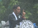 Trinamool Congress general secretary Abhishek Banerjee addresses party supporters in the rain during the Martyr's Day rally in Kolkata. (Photo by Samir Jana/Hindustan Times)