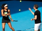 FILE - Japan's Naomi Osaka warms-up with her coach Wim Fissette(AP) FILE - Japan's Naomi Osaka warms-up with her coach Wim Fissette(AP)